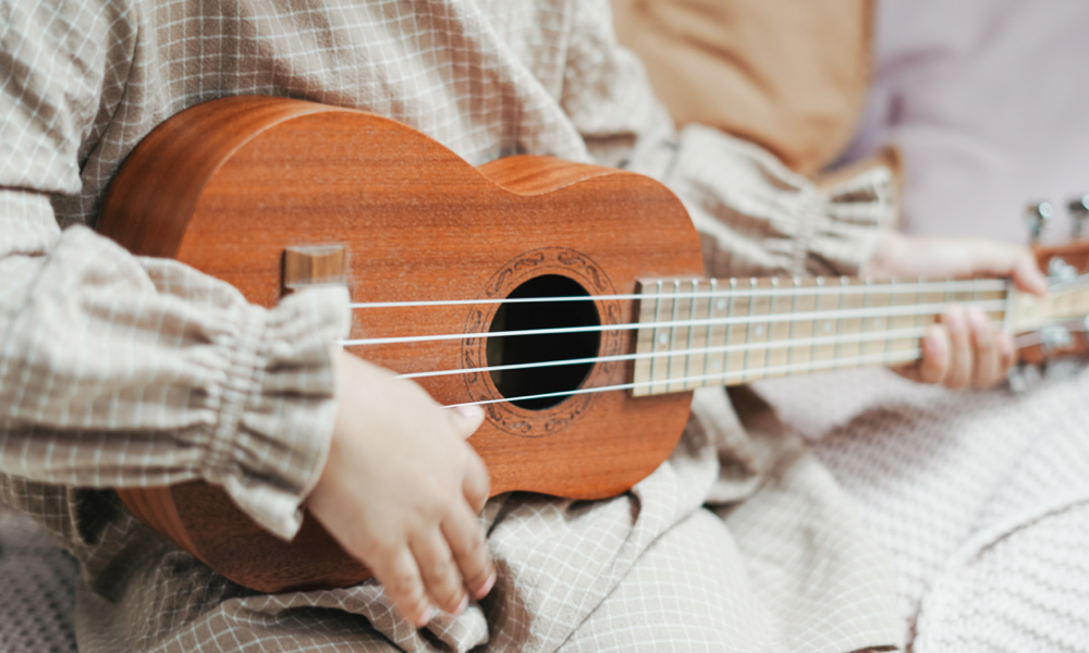 Photo by cottonbro studio: https://www.pexels.com/photo/photo-of-a-toddler-playing-a-ukulele-3662746/